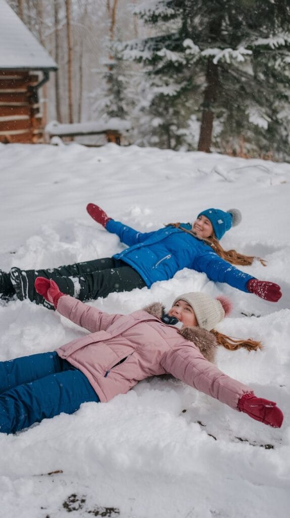 2-girls-making-snow-angels