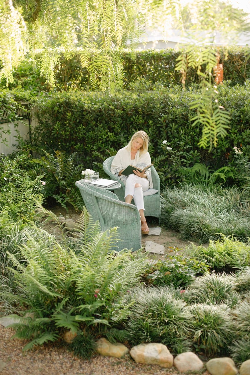 woman sitting in natural eco friendly garden