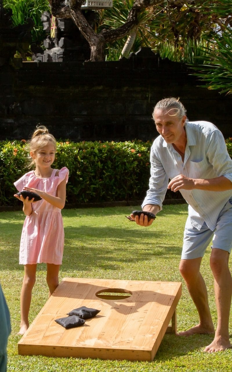 People-playing-corn-hole-lawn-game