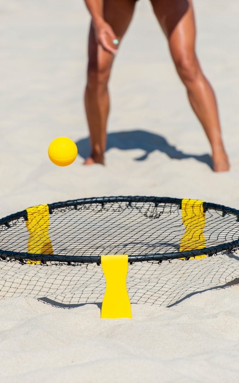 People-playing-spike-ball-on-beach