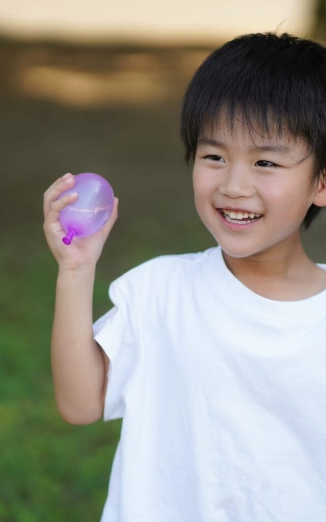 boy-holding-water-balloon